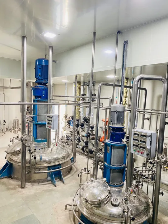 Two stainless-steel fermenters in the fermentation hall